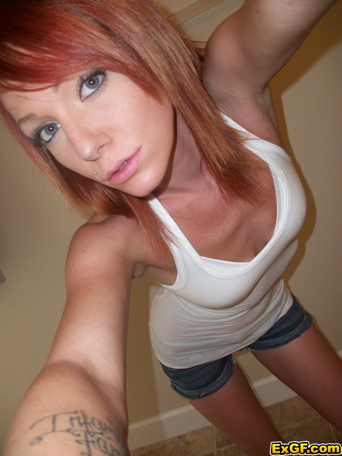 Sexy Redhaired Teen Posing Outdoors Indoors For the dirty Camera photo
